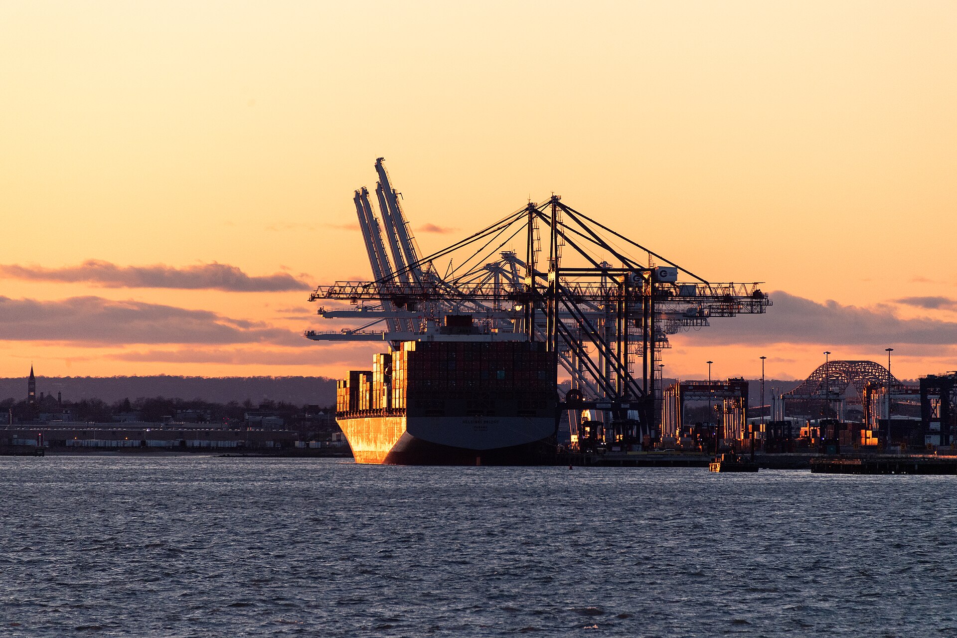 A container ship at dusk off Port Jersey